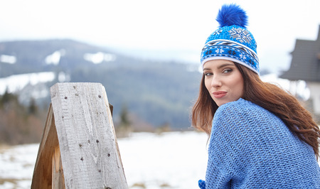 Portrait of happy young woman have fun at beautiful sunny winter dayの写真素材