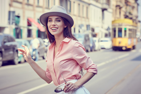Fashionably dressed woman on the streets of a small Italian townの写真素材