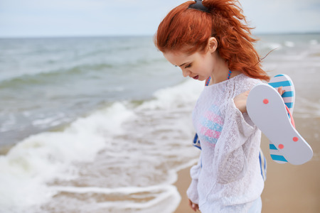 Beautiful young woman at the beach