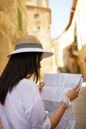 travel guide, tourism in Europe, woman tourist with mapの写真素材