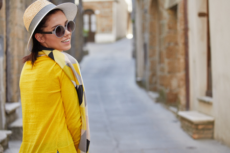 Tourist woman in a small Italian town. Vacation conceptの写真素材