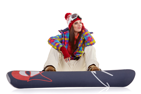 Woman with a snowboard. Winter sport conceptの写真素材