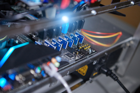 Cryptocurrency background (mining rig), Close up of array of GPUs for mining rig machine to mine for...