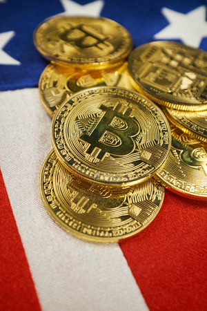 Bitcoin Gold Color on the Flag of USA. Cryptocurrency on Background of Flag of United States of...