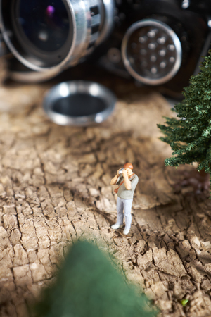 Miniature people photographer : shooting  a Retro, old, vintage and classic film cameraの写真素材