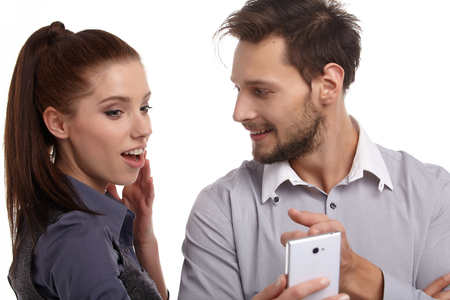 The new phone generation is playing. Couple conceptの写真素材