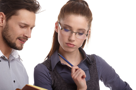 Portrait of a couple of business people working. Isolated shootの写真素材