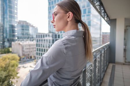 Beautiful business woman on the background of the modern officeの写真素材