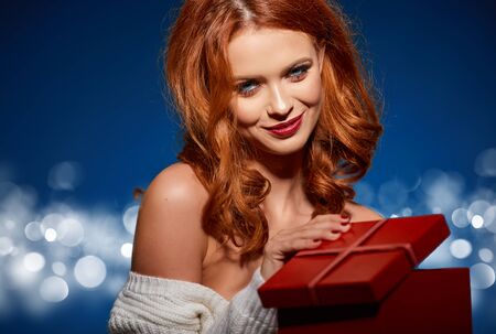 Woman with christmas box giftの写真素材