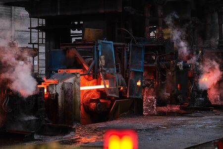 Melting of metal in a steel plant. High temperature in the melting furnace. Steel millの写真素材