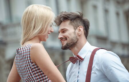 Portrait of smiling beautiful girl and her handsome boyfriend. Woman in casual summer jeans clothes....