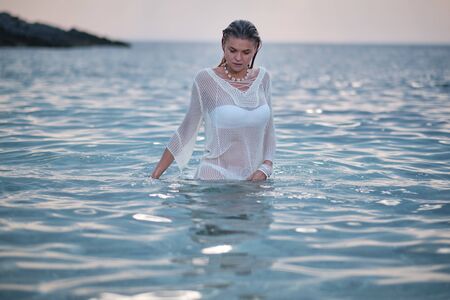 beautiful sensual girl in water portraitの写真素材