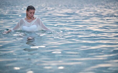 beautiful sensual girl in water portraitの写真素材