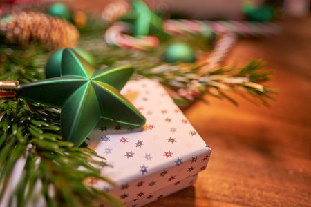 Christmas composition with spruce branch and gifts. wood table. top downの写真素材
