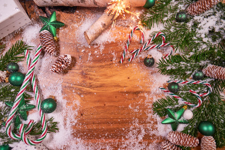 Christmas composition with spruce branch and gifts. wood table. top downの写真素材