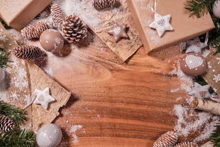 Christmas composition with spruce branch and gifts. wood table. top downの写真素材