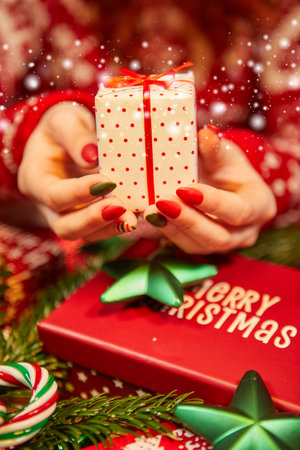 woman hands hold christmas gift boxの写真素材