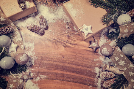 Christmas wooden background with snow fir tree. View with copy spaceの写真素材