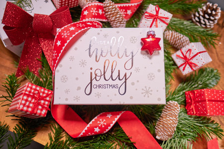 Christmas dark background with christmas decoration, christmas candy canes, fir branch, top viewの写真素材