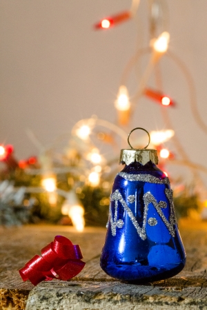 christmas ornament and lights on woodの写真素材