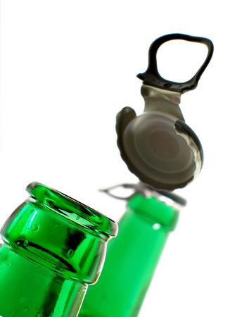 Opening beer bottle isolated over white backgroundの写真素材