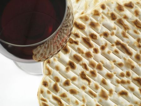 Red wine and matzoh - tradition jewish passover bread close up