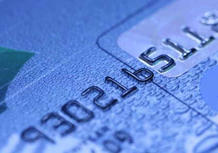 Digits on the blue credit card super close-upの写真素材