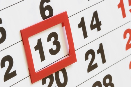 Sheet of calendar with red mark on Friday, 13