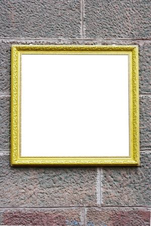 Blank antique frame over stone wall close-upの写真素材