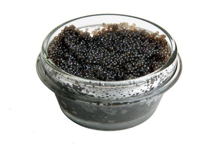 Jar of black caviar isolated over white の写真素材