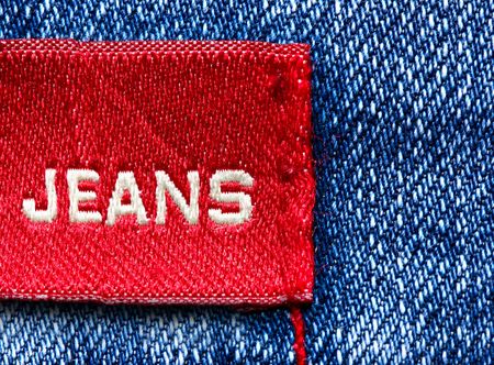 Blue jeans and red label with word Jeansの写真素材