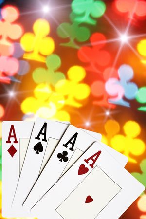 Four aces close-up over colorful clubs background