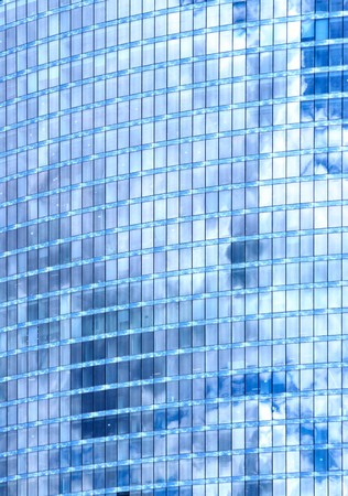 Glass wall of skyscraper and sky reflection, may be used as background