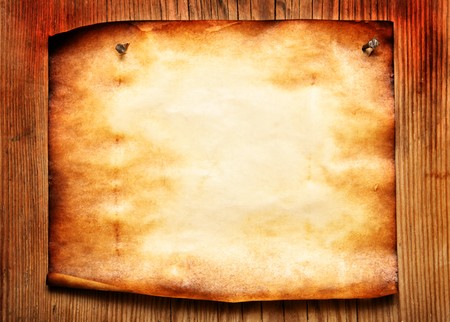 Old paper attached to wooden wall, may be used as backgroundの写真素材