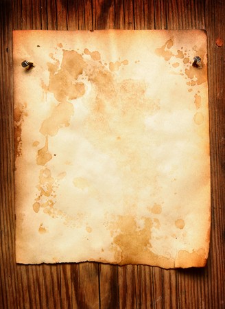 Old paper attached to wooden wall, may be used as backgroundの写真素材