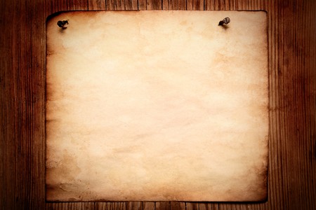 Old paper attached to wooden wall, may be used as backgroundの写真素材