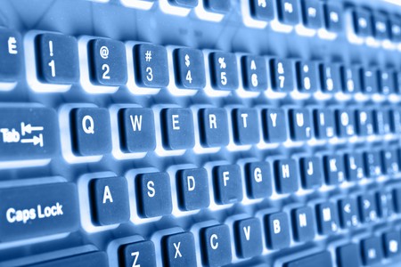Keyboard close up toned in blue color