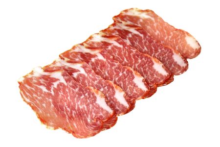 Slices of ham isolated over white backgroundの写真素材