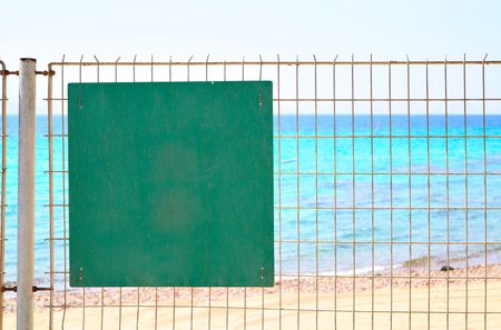 Warning sign on fence. Put your own text here