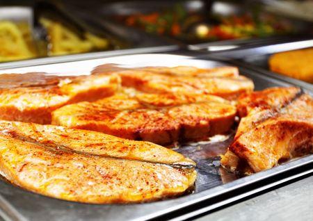 Hot tray with grilled salmon. Shallow DOF!の写真素材