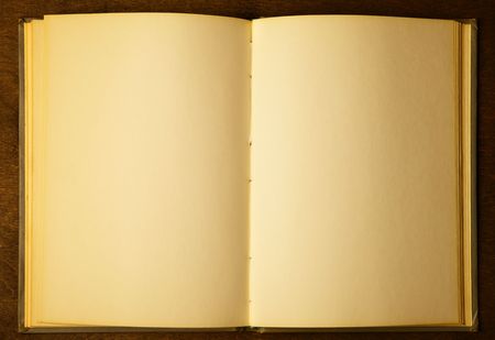 Opened book with blank pages on wooden tableの写真素材