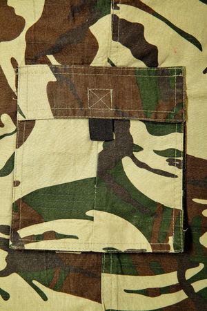 Camouflaged textile close-up, may be used as background