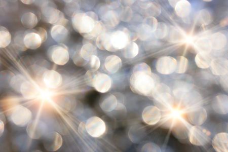 Holiday lights out of focus with stars, may be used as backgroundの写真素材