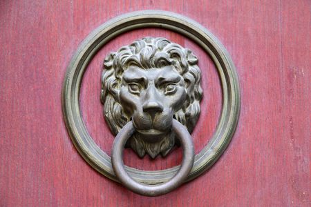 Door knocker in the form of lion headの写真素材