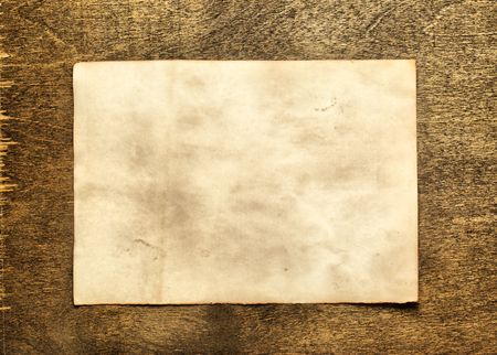 Old paper close up on wooden tableの写真素材