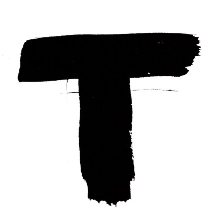 T - Black ink letters isolated over the white backgroundの写真素材