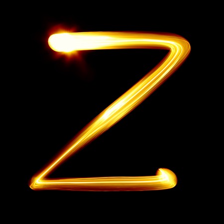 Created by light alphabet over black backgroundの写真素材