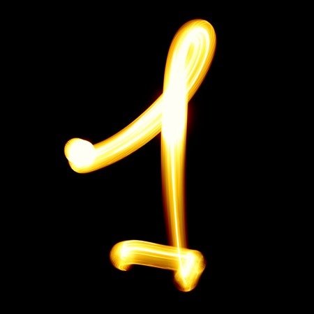 Created by light digits over black backgroundの写真素材