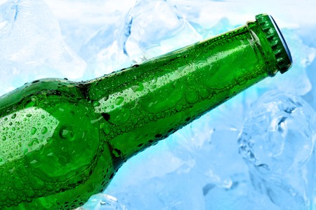 Single bottle of beer and ice close-up の写真素材