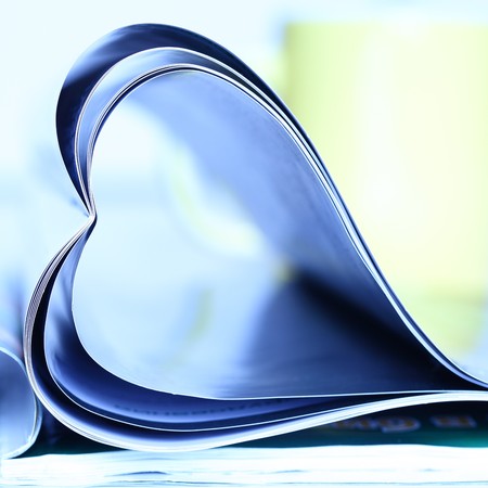 Magazine folded to heart shapeの写真素材